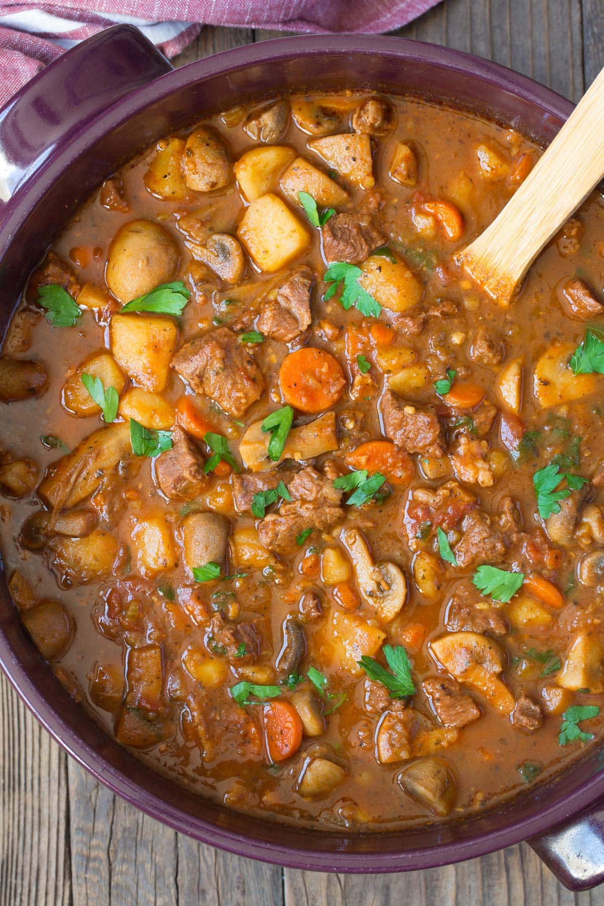 Overhead shot of beef stew in a large stock pot. 