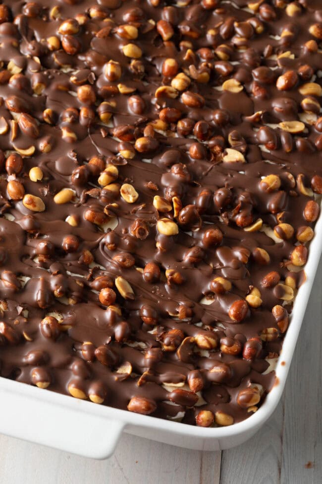 Buster bar ice cream cake in a white baking dish.