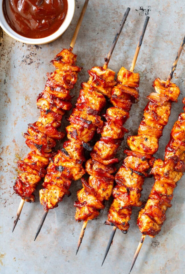 Chicken Skewers #ASpicyPerspective #Chicken #Bacon #BBQ #Chipotle #Skewers #ChickenSkewers #BBQChicken #ChickenSkewersRecipe #BBQSkewers #ChipotleChicken #Grill #Summer Chicken Skewers Recipe with Chipotle BBQ Sauce on grill or in oven
