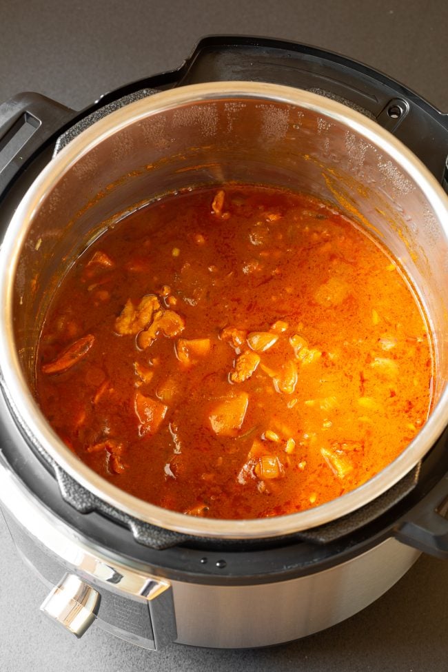 butter chicken curry cooking in an instant pot. 