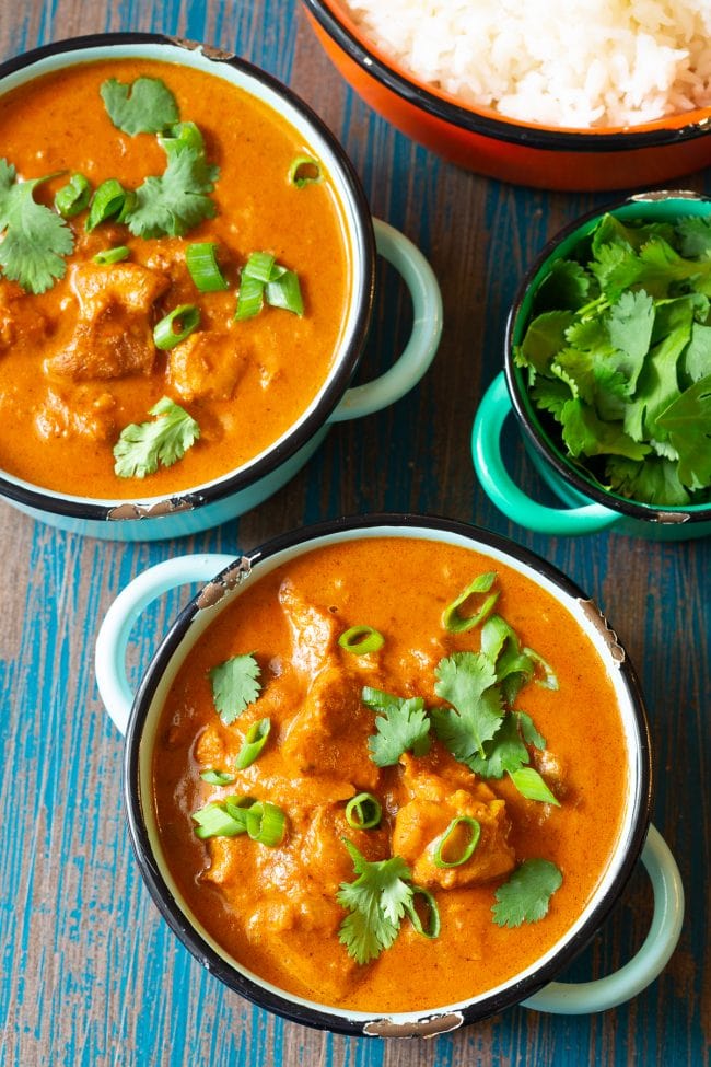 Instant Pot Curry - two bowls of instant pot chicken curry next to a bowl of rice. 