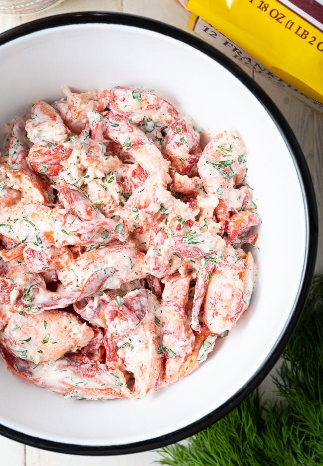 Lobster roll filling mixed in a mixing bowl. 