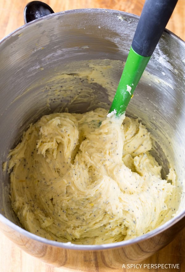 Lemon Poppy Seed Cookies #ASpicyPerspective #Lemon #PoppySeed #SoftCookies #EasyLemonCookies #PoppySeedRecipes #PoppySeedCookies #Summer #Spring #Easter lemon cookie dough in a stand mixer bowl with a rubber spatula.