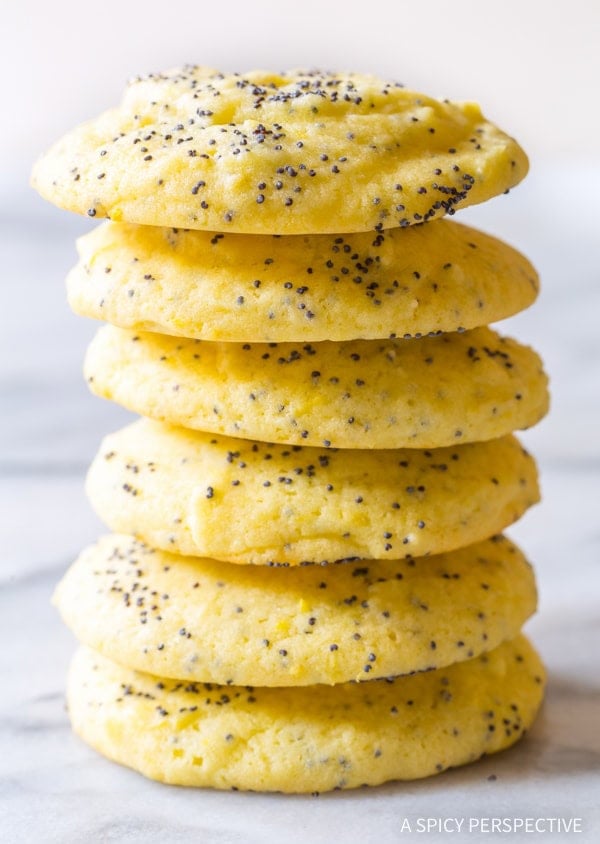 Lemon Poppy Seed Cookies #ASpicyPerspective #Lemon #PoppySeed #SoftCookies #EasyLemonCookies #PoppySeedRecipes #PoppySeedCookies #Summer #Spring #Easter Lemon poppy seed cookies stacked on top of each other.